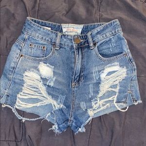Ripped blue jeans shorts